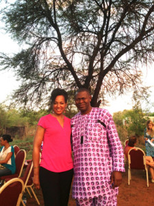 Young Global Leaders Teresa Kennedy and Akinwale Ojomo under the Tree where the Royal Bafokeng Nation Community Leaders Meet