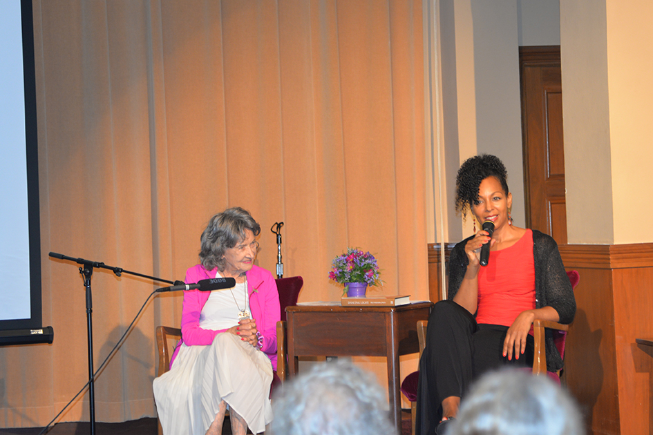 97-year-old yoga master Tao Porchon-Lynch and empowerment expert Teresa Kay-Aba Kennedy leading The Gandhi Effect workshop in Kansas City