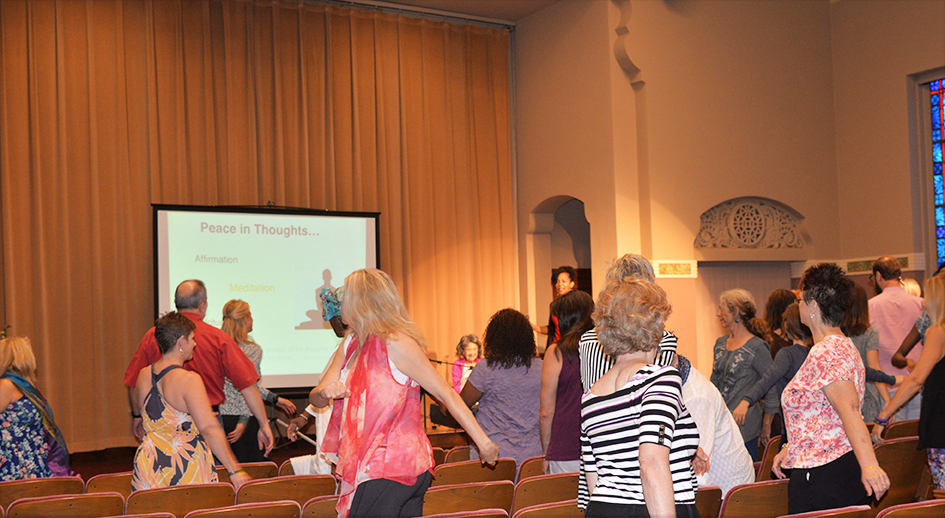 97-year-old yoga master Tao Porchon-Lynch and empowerment expert Teresa Kay-Aba Kennedy leading The Gandhi Effect workshop in Kansas City