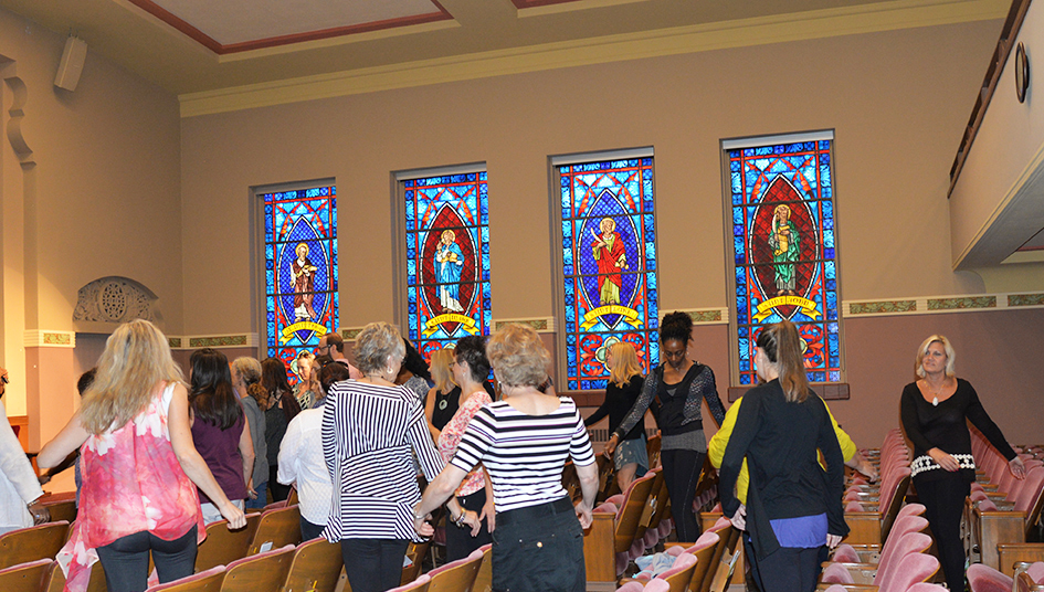 97-year-old yoga master Tao Porchon-Lynch and empowerment expert Teresa Kay-Aba Kennedy leading The Gandhi Effect workshop in Kansas City