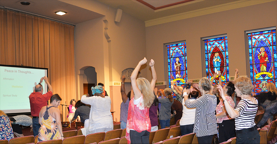 97-year-old yoga master Tao Porchon-Lynch and empowerment expert Teresa Kay-Aba Kennedy leading The Gandhi Effect workshop in Kansas City