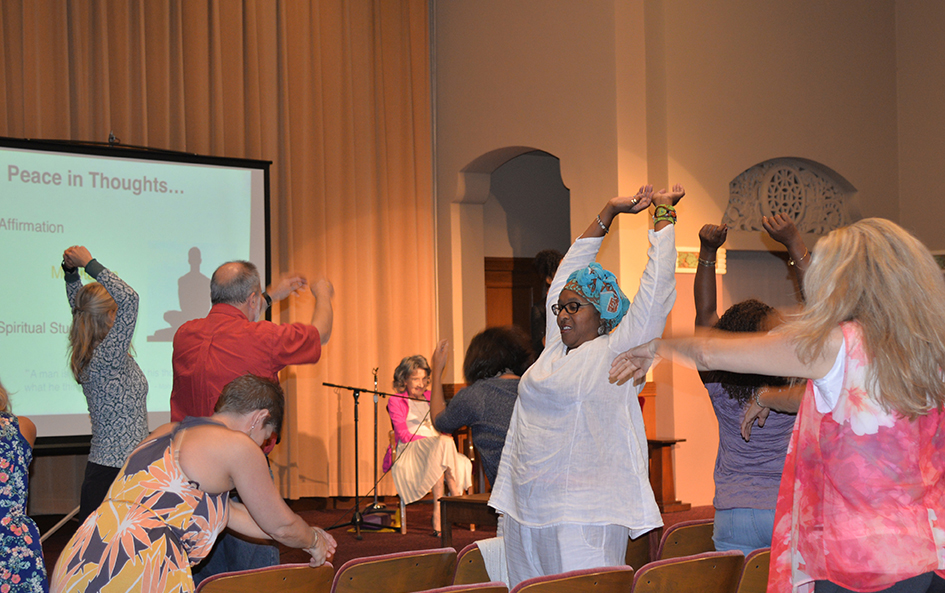 97-year-old yoga master Tao Porchon-Lynch and empowerment expert Teresa Kay-Aba Kennedy leading The Gandhi Effect workshop in Kansas City