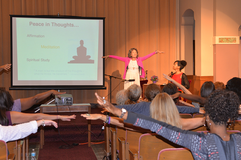 97-year-old yoga master Tao Porchon-Lynch and empowerment expert Teresa Kay-Aba Kennedy leading The Gandhi Effect workshop in Kansas City