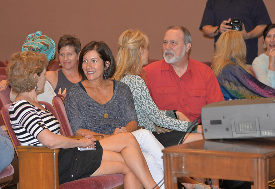 Participants in interactive exercise during The Gandhi Effect workshop with 97-year-old yoga master Tao Porchon-Lynch and empowerment expert Teresa Kay-Aba Kennedy in Kansas City