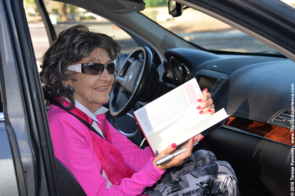 97-year-old yoga master Tao Porchon-Lynch signing a book outside of ABC15, September 25th, 2015