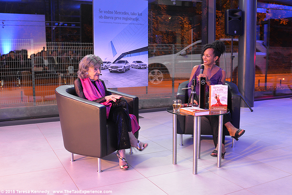 97-year-old yoga master Tao Porchon-Lynch and Teresa Kay-Aba Kennedy presenting at Conversation with a Master event hosted by the Young Executives Society (YES) and Mercedes in Slovenia, October 8, 2015